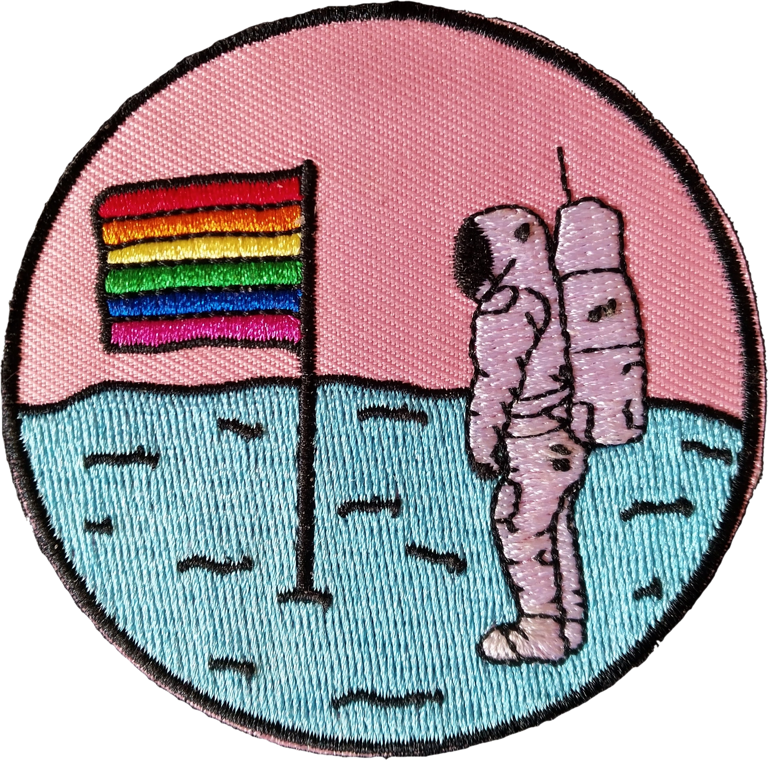 A patch with an astronaut stood next to a flag pole displaying the pride flag