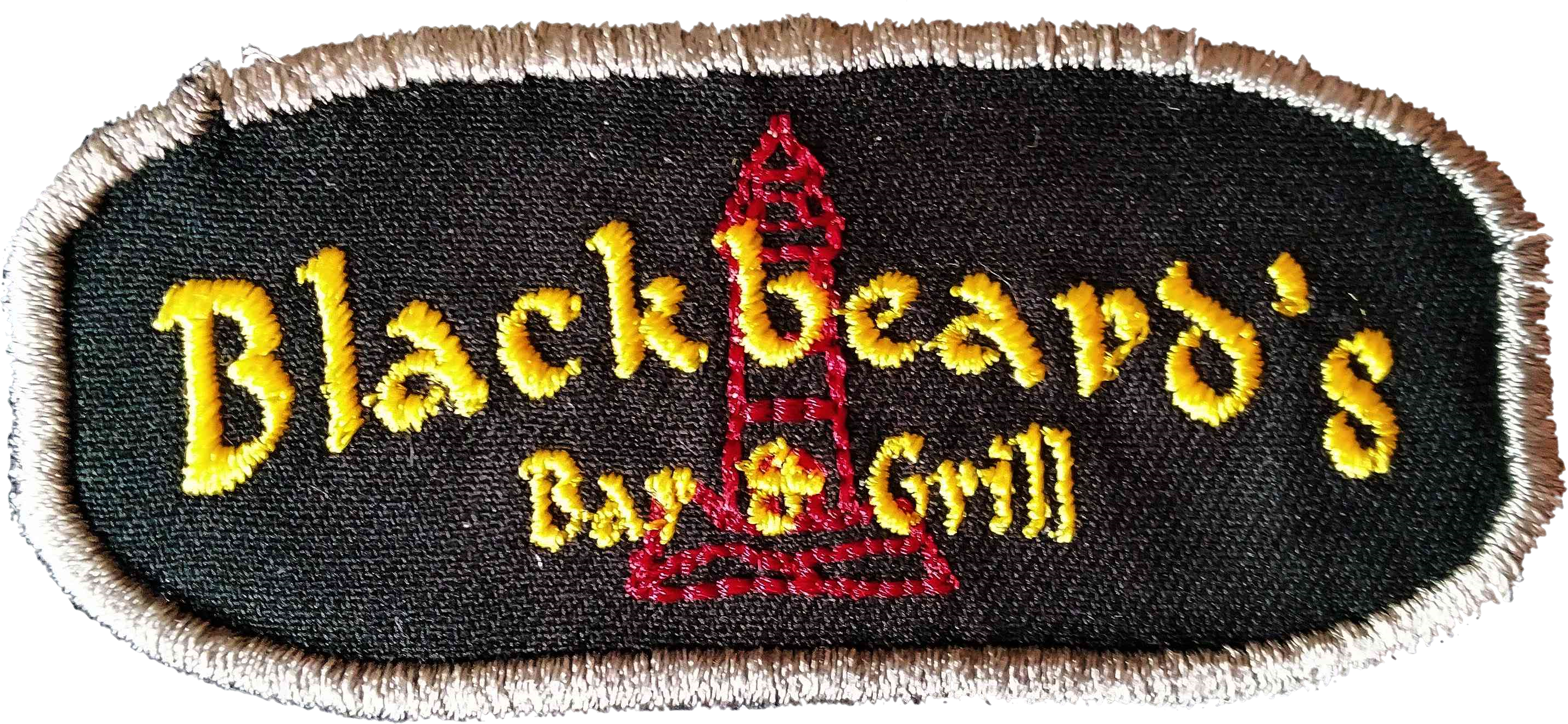 A patch of the words 'Blackbeard's Bar and Grill' overlaying the outline of a building