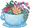 A teacup filled with plants